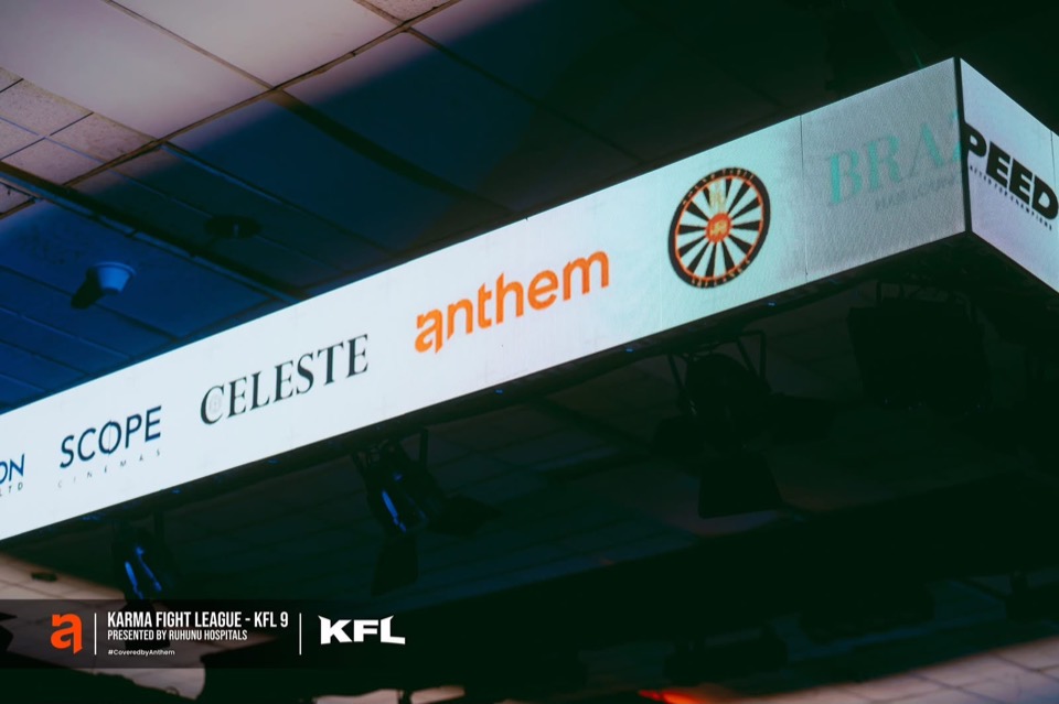 Hanging LED screens above the ring showing sponsor logos
